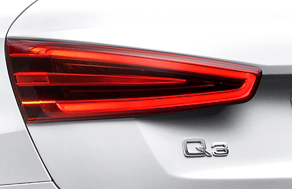 Audi Q3: Moderne Leuchteinheit hinten mit Modellschriftzug. 
